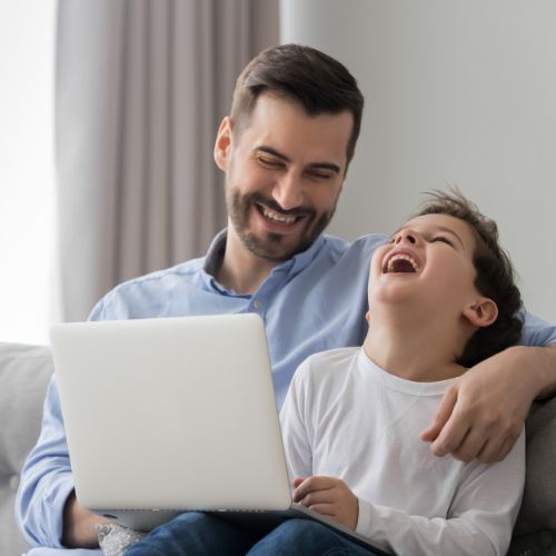 dad and boy laughing