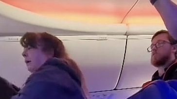 southwest kicks off lady with dog