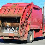 people getting stuck in garbage trucks