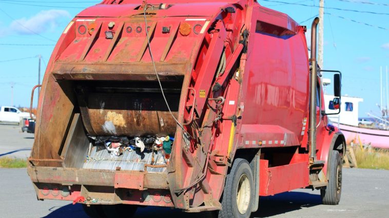people getting stuck in garbage trucks