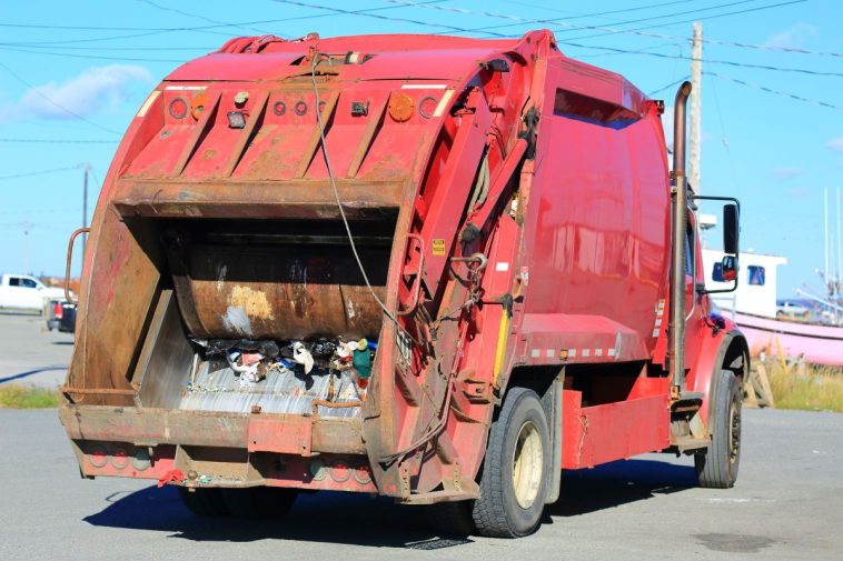 people getting stuck in garbage trucks